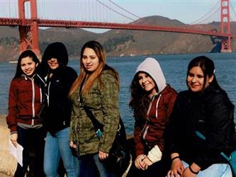 5 students standing by Golden Gate Bridge