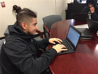 a student working on a laptop computer